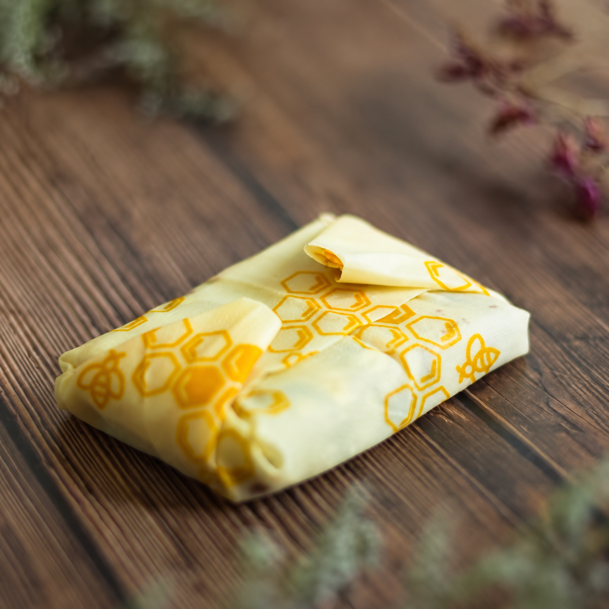 Honeycomb beeswax wrap folded around a rectangular parcel