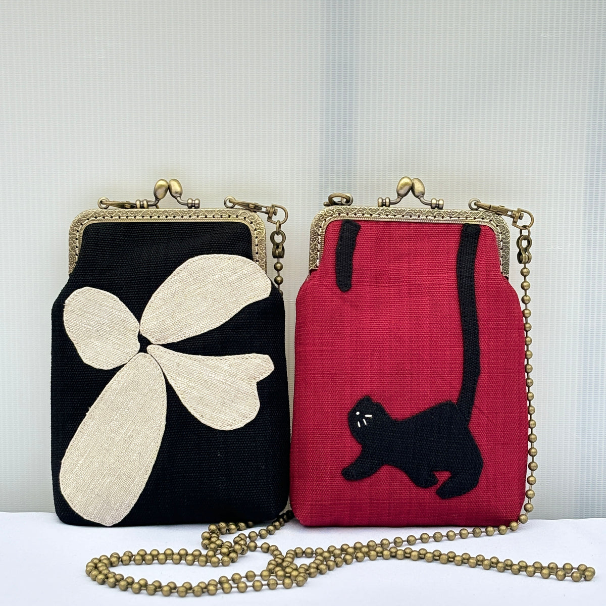 Applique Ramie Kiss-Lock Phone Bag design options shown in Xiabu ramie textile
