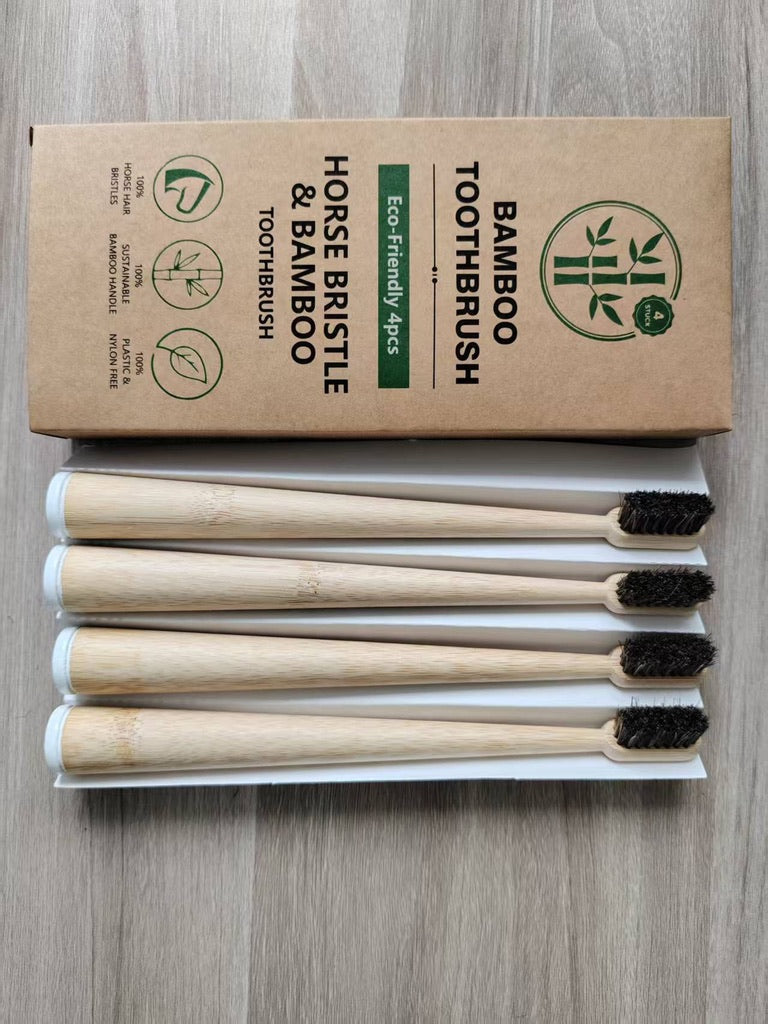 Four round bamboo toothbrushes with dark horsehair bristles, four-pack packaging; photo shows the four-pack